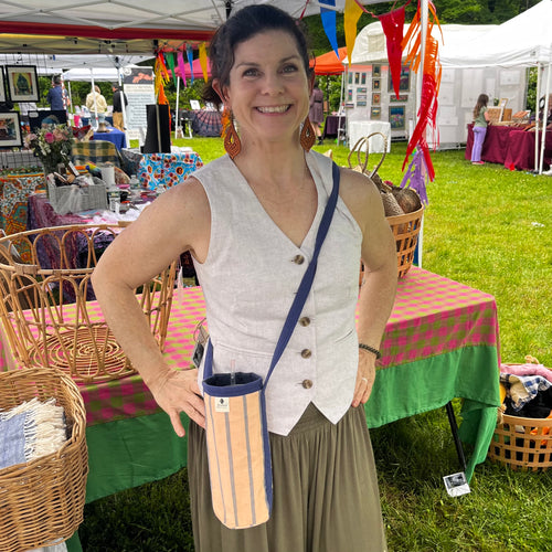 Cross body bottle carrier in handwoven fabric